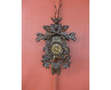 A Black Forest carved wood cuckoo clock 