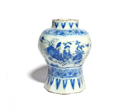 A Delft vase  c.1660-80, of baluster form raised on an octagonal foot, painted with Chinese figures at various pursuits in a 