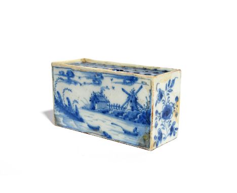 A delftware flower brick  c.1740, the rectangular form painted to the longer sides with a figure in a boat before a windmill 