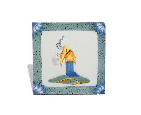 A Liverpool delftware tile  c.1750-70, decorated in polychrome enamels with a Chinese figure holding a cooking pot, reserved 