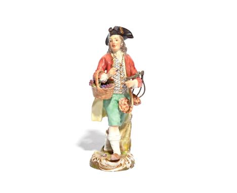 A Meissen Cris de Paris figure of a grape seller 19th century, after the model by Peter Reinicke, a basket of grapes hanging 