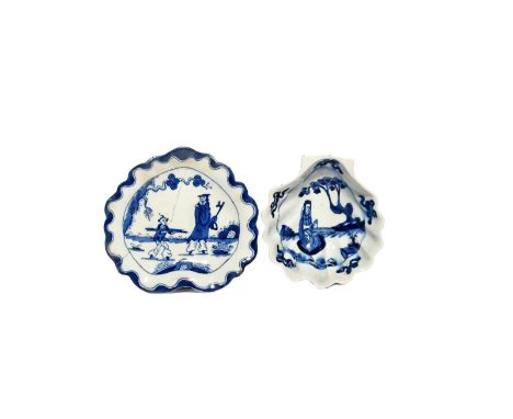 A Bow blue and white dish c.1755-60, painted with the Golfer and Caddy pattern of a young boy carrying clubs behind a taller 