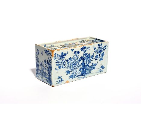 A large delftware flower brick  c.1750-60, one long side painted with a pagoda landscape, the reverse with flowering peony, b