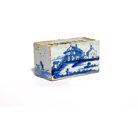 A small delftware flower brick  c.1750, the rectangular form painted to one side with a figure walking a dog before a half-ti