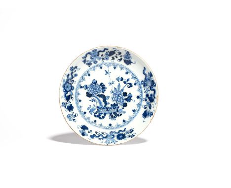 An Irish (Dublin) delftware saucer dish  c.1750, the well painted in a deep blue with flowering chrysanthemum branches issuin