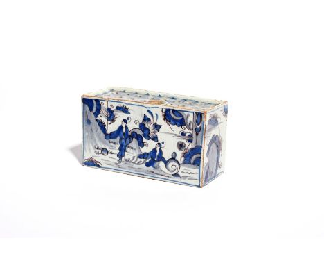 A delftware flower brick  c.1730-40, the large rectangular form painted in blue and manganese with Chinese figures in a garde