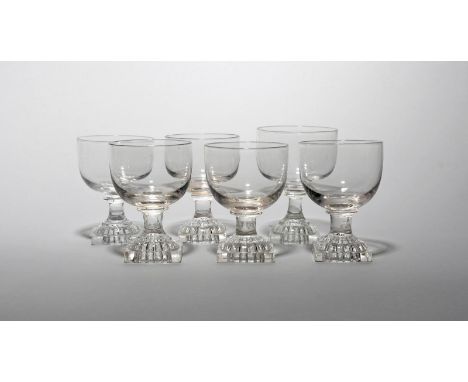 Six glass rummers  19th century, with generous rounded bowls raised on short stems and square lemon squeezer bases, 11.4cm ma