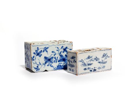 Two small delftware flower bricks  c.1740-50, both decorated in blue with loose flowering plants, the larger seeming to inclu