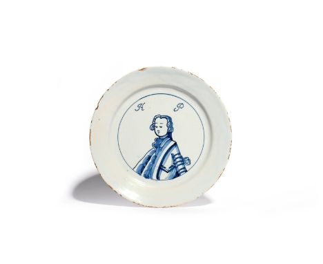 A rare English delftware King of Prussia plate  c.1757-60, painted in blue with a head and shoulders portrait of Frederick II