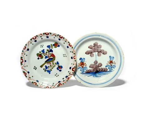 Two delftware plates  c.1740-50, probably Bristol, one painted in red, green and blue with a bird perched on a flowering bran