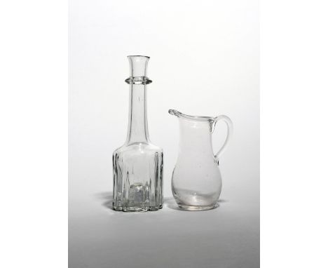 A cruciform decanter or serving bottle  c.1740, the heavy base rising to a tall neck with slightly flared rim above an applie