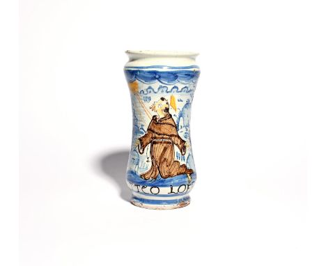 A Naples maiolica albarello  c.1740, the slender waisted form painted with St Francis receiving the stigmata, inscribed above