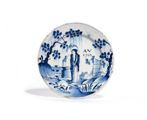 A delftware plate  dated 1748, possibly Bristol, painted in blue with a Long Eliza figure holding a parasol before buildings 
