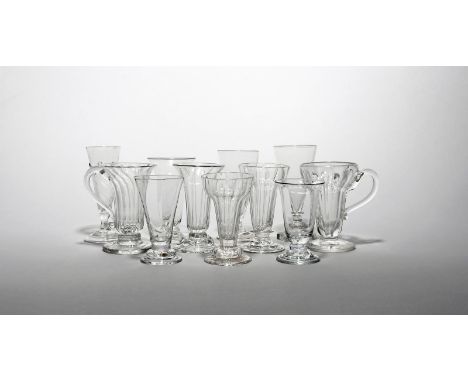 Eleven dwarf ale or jelly glasses 18th/early 19th century, one with wrythen moulding and a flammiform edge above a folded foo