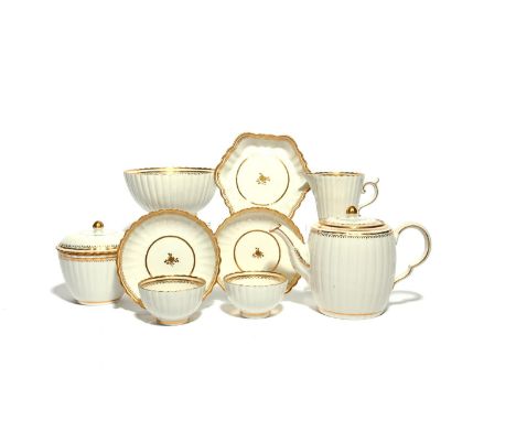 A Caughley part tea service  c.1790, the fluted forms simply decorated with narrow gilt bands on a white ground. Comprising: 