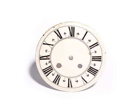 An English delftware clock dial  c.1780, painted in manganese with Roman numeral hours, pierced or drilled with several circu