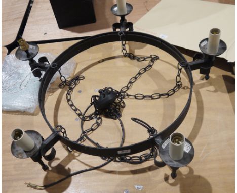 A contemporary black painted wrought iron five-light chandelier, suspended from chains, electrified, approx. 73cm diam. inc. 