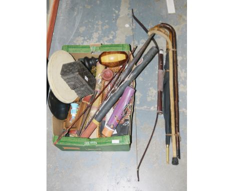 Collection of vintage umbrella and walking canes, a carved wooden Indonesian bow and arrow, an Egyptian formed pyramid box an
