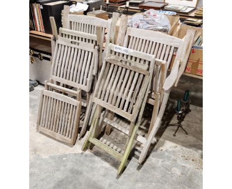 An assembled set of weathered teak garden furniture, including a pair of folding chairs,&nbsp; labelled Chic Teak, a footstoo