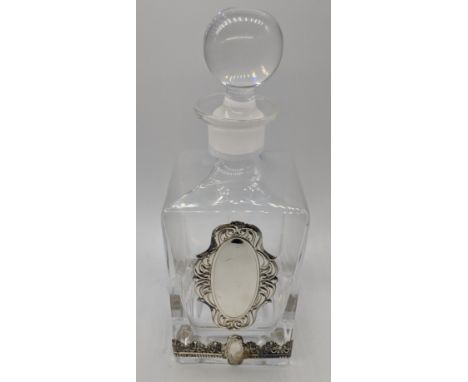 An Israeli glass decanter with silver banding and a vacant silver cartouche, H.26cm