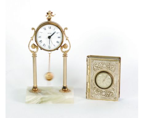 'RITZ' GILT METAL AND GREEN ONYX MINIATURE PORTICO TYPE DRESSING TABLE CLOCK, SIMILAR SET OF BALANCE SCALES  AND A BRASS BOOK