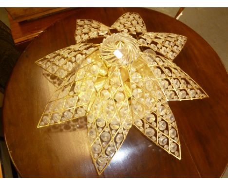 A GILT COLOURED ROTATING STAR SHAPED LIGHT FITTING 