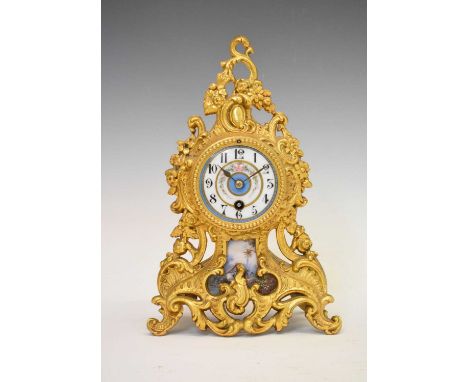 Gilt metal cased mantle clock, blue and white porcelain chapter ring dial with black Arabic hour markers, with lower panel de