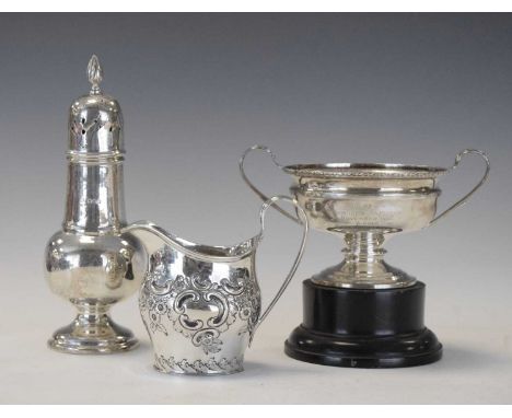 Edwardian silver cream jug with embossed decoration, London 1901, together with a 1920s sugar caster and small twin handled t