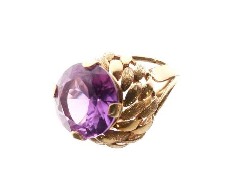 Synthetic purple sapphire '18K' yellow metal ring, the circular faceted stone measuring approximately 12mm diameter x 6mm dee