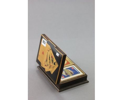 An Early 20th century Wooden Inlaid Playing Card Box with White Star Line Playing Cards