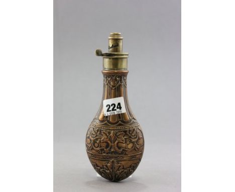 A 19th century Copper and Brass Powder Flask Art Nouveau Embossed Decoration