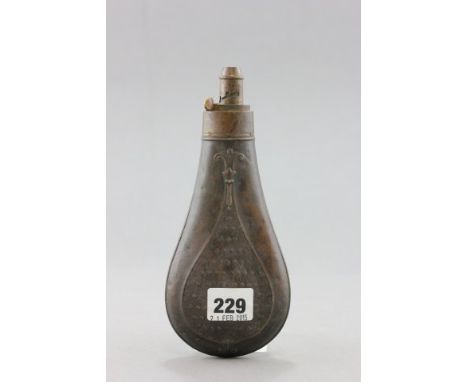 A 19th century Copper and Brass Powder Flask with embossed panel decoration