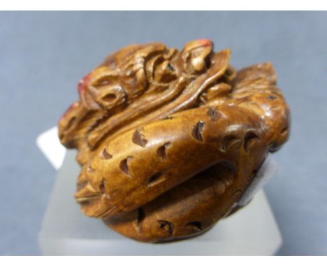 A Netsuke of a Dragon Spitting Pearl 