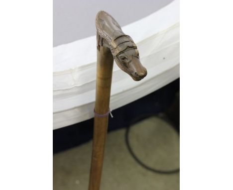 A Walking Stick Crafted in Crete carved with a horses head and bearded male 