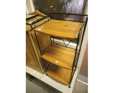 A Folding Wrought Iron Shelf Unit with wooden shelves 