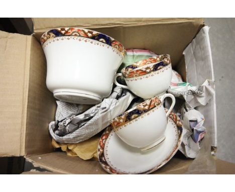 An Early 20th century Tea Service with red, blue and gilt edge including six cups, saucers, tea plates, slop bowl and sandwic