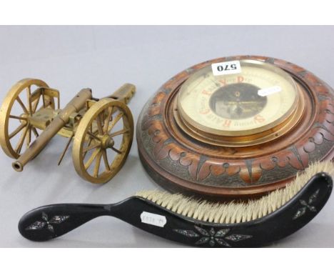 An Early 20th century Oak Cased Circular Barometer, Brass Model Canon in Papier Mache with mop crumb brush