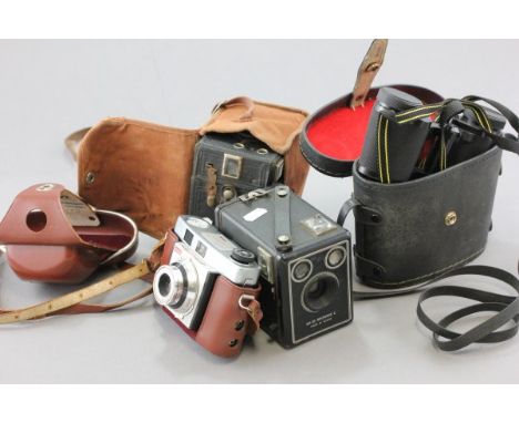 A Pair of Binoculars and Three Vintage Cameras 