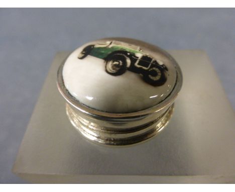 A Silver and Enamel Pill Box inset with a Classic Car 