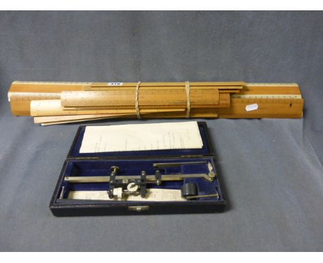 A Collection of Mainly Vintage Wooden Rulers including Shrink Rules plus a cased polar planimeter  