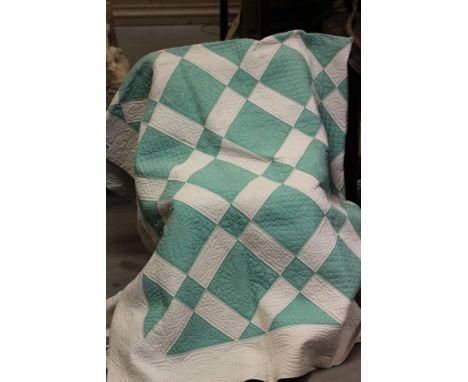 A Vintage Green and White Bedspread 