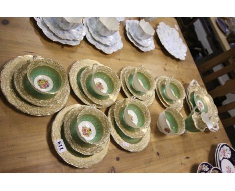 A George Jones & Son Tea Service comprising Six Cups, Saucers and Tea Plates, Milk, Sugar and Sandwich Plate