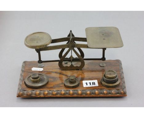 A Set of Early 20th century Oak and Brass Postal Scales with weights 