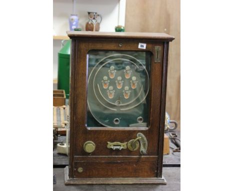 A Vintage Oak Cased Penny Arcade Machine, probably by Allwins 