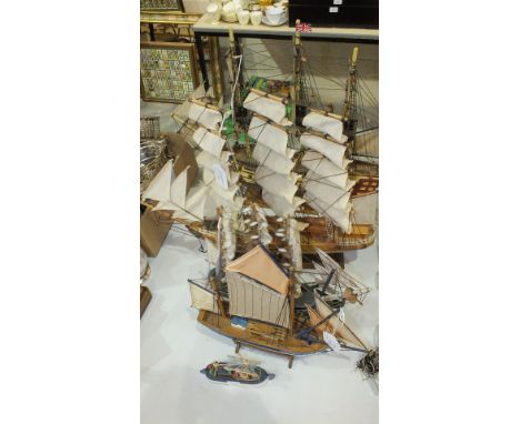 A wooden model of HMS Victory, on stand, 50cm long, 45cm high and four other ships models, (5).