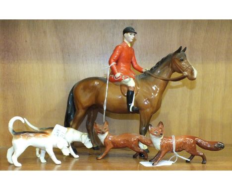 A Beswick model, Huntsman, style two, standing, 21cm, brown gloss, two foxes, standing and two foxhounds, (5).