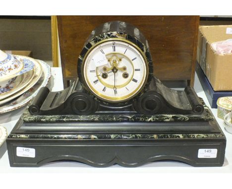 A black slate and green marble striking drum mantel clock, the white chapter ring enclosing a recessed visible escapement, si