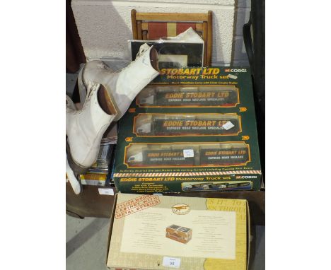 A Corgi Eddie Stobart Ltd motorway truck set, a Spirit of St Louis radio/alarm clock, three two-piece pool cues and other ite