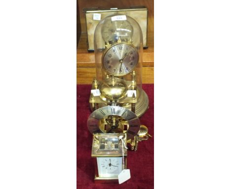 A brass carriage timepiece, the dial marked H Samuel, Made in England, 15cm high, A German brass 400-day clock under a glass 