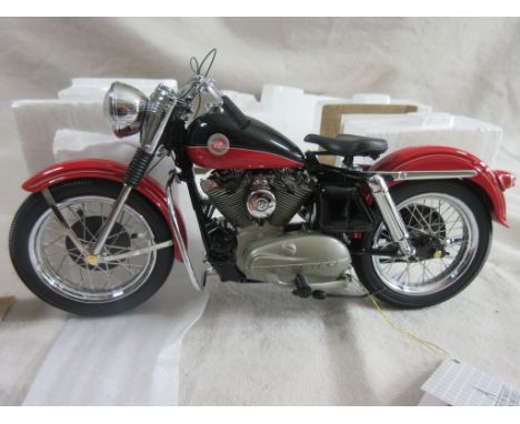 A 1:10 die-cast Model by Franklin Mint of a 1957  Harley Davidson XL Sportster, length approx 22cm,  in box of issue.